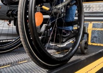 Wheelchair accessing adaptive ramp